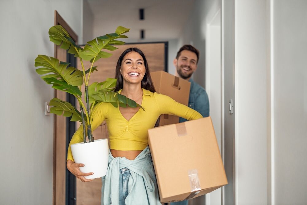 happy couple moving into their apartments in westwood