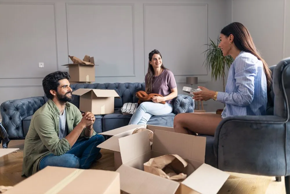 Three roommates moving into the Kansas City luxury apartments
