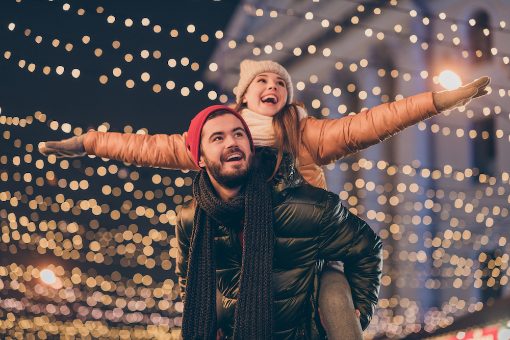 A Young couple enjoying the holiday lights around Kansas City