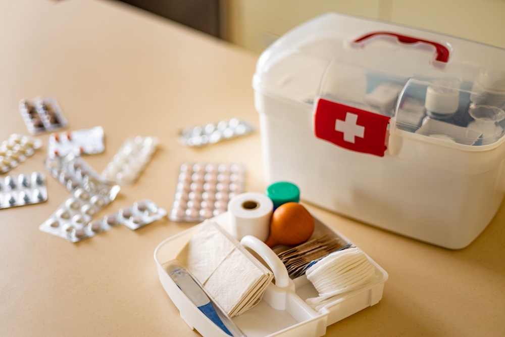 A first aid kit laid out on the counter