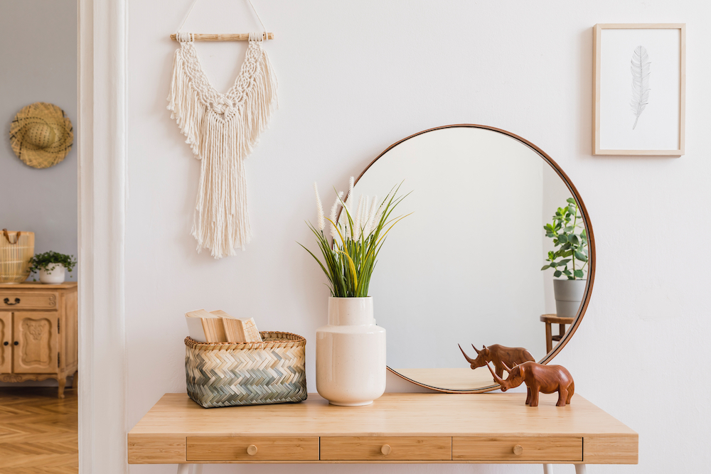 Minimalist decor sits on top of a dresser in a bedroom