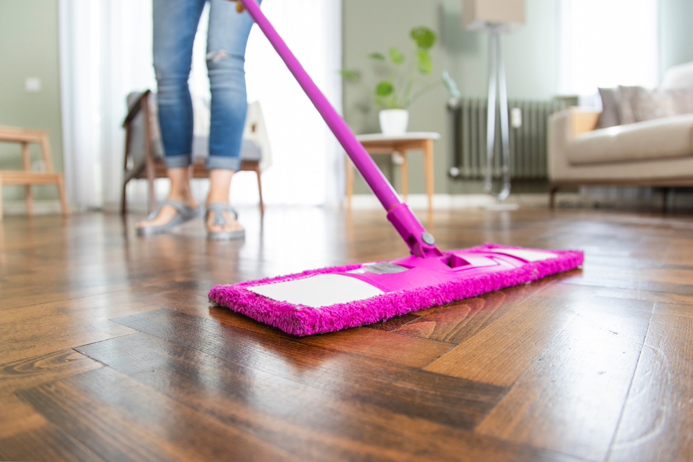 A woman mopping floors at the Kansas City luxury apartments