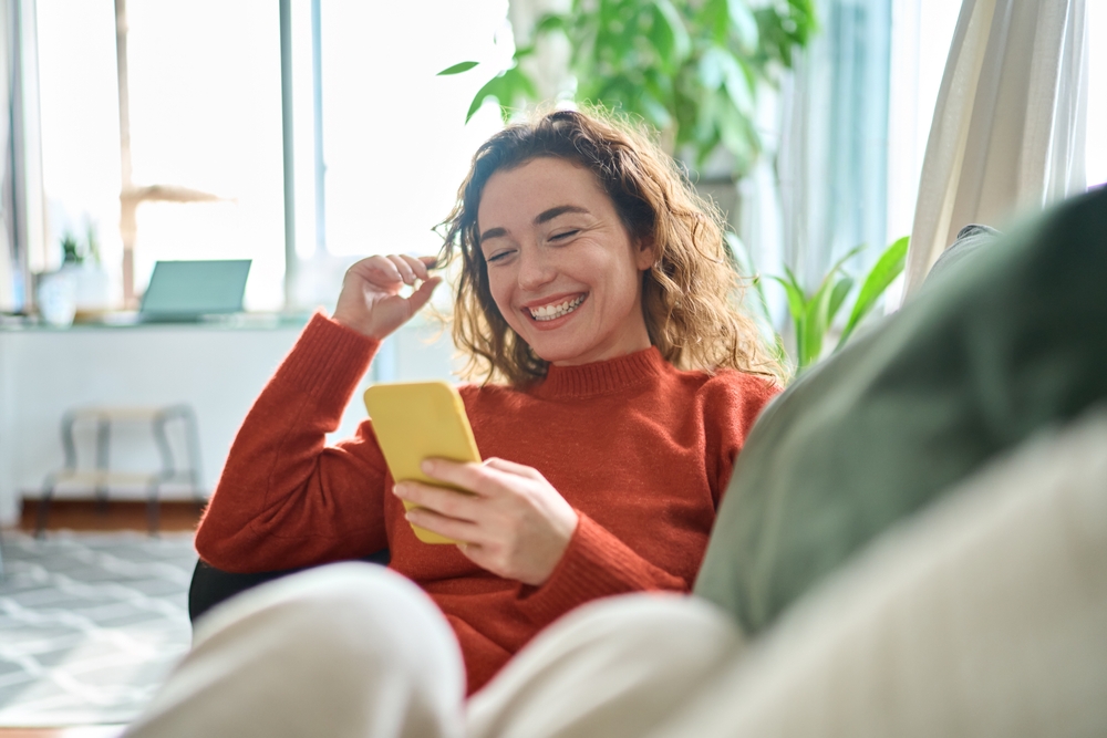 Young, happy woman in studio apartments in Kansas city.