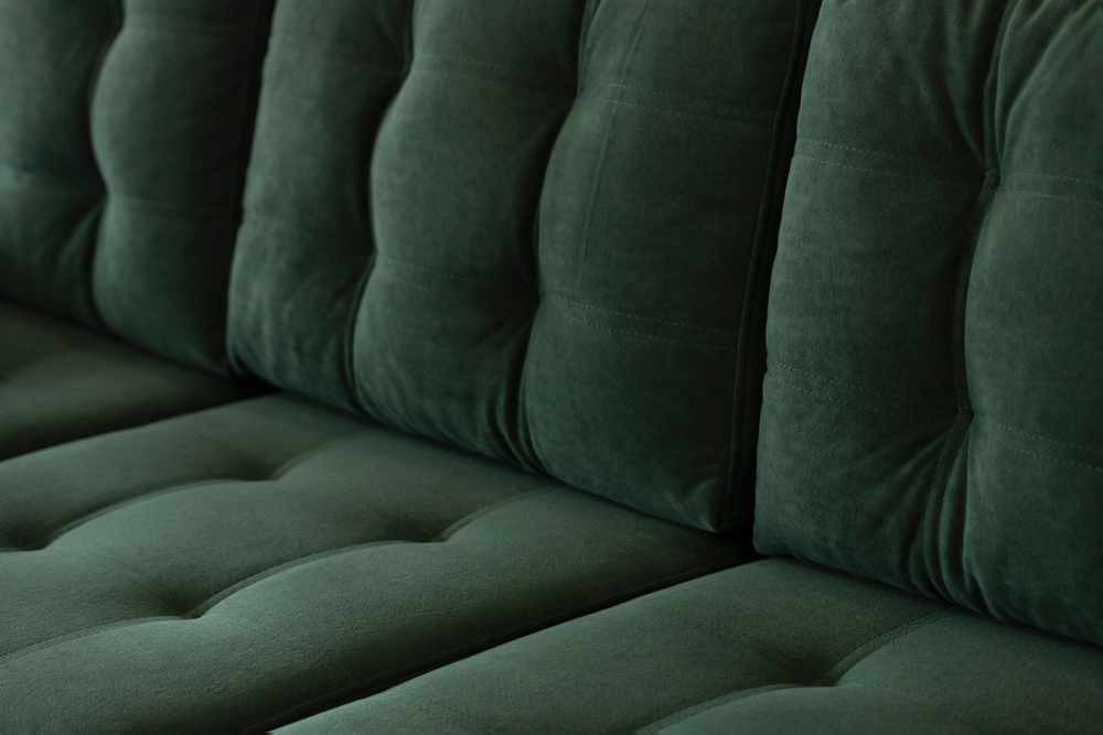 Green sofa in apartments in Westwood, KS.