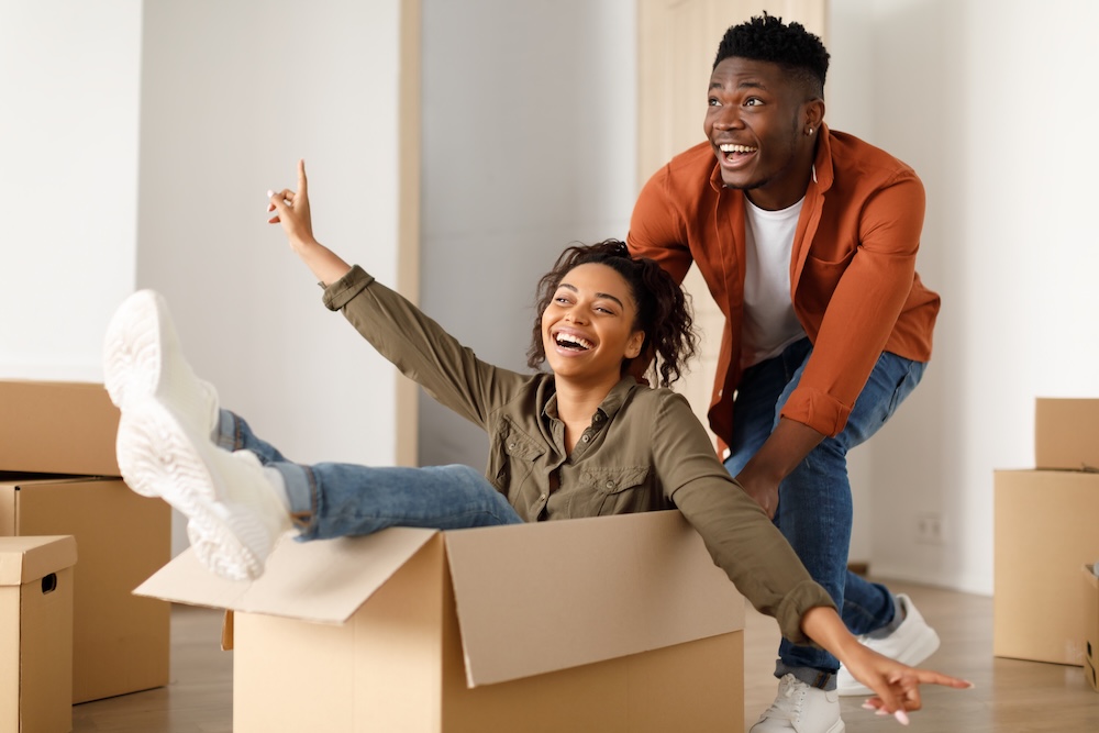 Happy couple moving into their apartments in Westwood